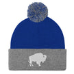 Blue and grey pom pom beanie winter hat with embroidered Buffalo silhouette logo, modern Buffalo inspired winter accessory.