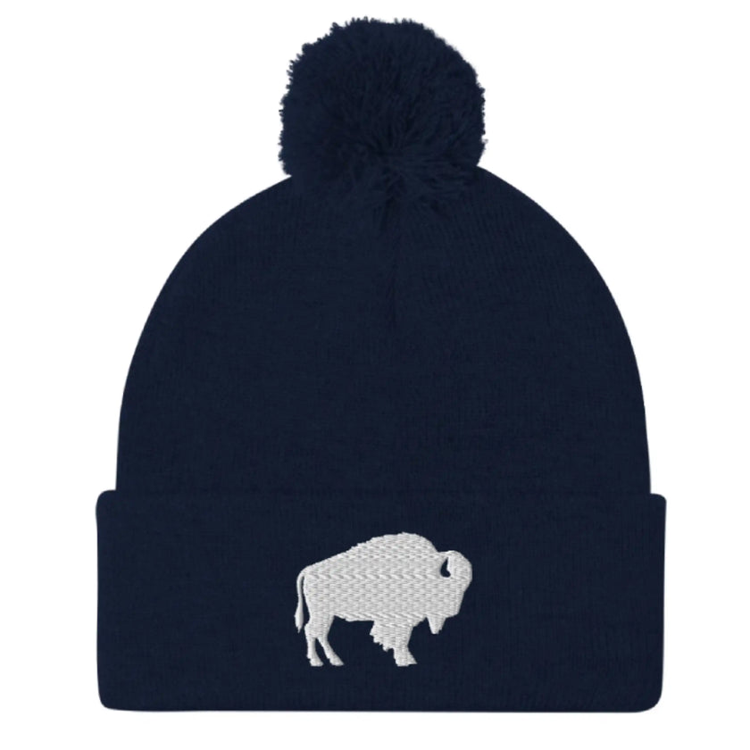 Navy pom pom beanie winter hat with embroidered Buffalo silhouette, classic Buffalo inspired winter headwear design with clean stitching.