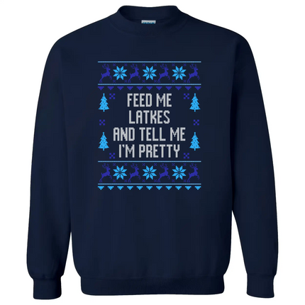 Navy blue Hanukkah sweatshirt with ‘Feed Me Latkes and Tell Me I’m Pretty’ ugly sweater style lettering, knitted font design with reindeer and snowflakes for cute festive holiday wear.