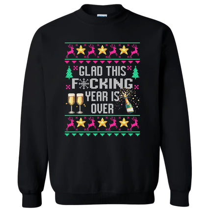 Black New Year ugly sweater sweatshirt featuring ‘Glad This F*cking Year Is Over’ in knitted-look lettering with snowflake symbol, champagne bottle, reindeer, and festive star details.