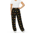 Back view of Buffalo Halloween pajama pants with spooky candy corn color pattern featuring orange yellow white buffaloes, candy corn shapes, stars, and moons