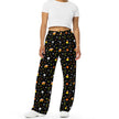 Black Halloween lounge pants featuring candy corn inspired Buffalo silhouettes in orange yellow and white with repeating candy corns, stars, moons, and festive dots