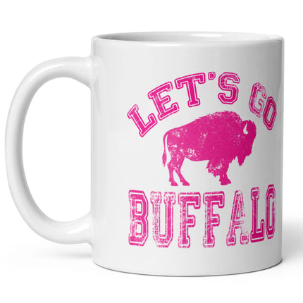 White ceramic coffee cup featuring hot pink distressed ‘Lets Go Buffalo’ lettering and hot pink buffalo silhouette design on left side view, game day Buffalo football drinkware.