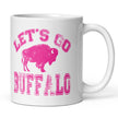 White ceramic coffee cup showing hot pink distressed Buffalo football design with ‘Lets Go Buffalo’ text and buffalo silhouette on right side view.
