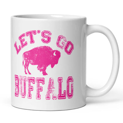 White ceramic coffee cup showing hot pink distressed Buffalo football design with ‘Lets Go Buffalo’ text and buffalo silhouette on right side view.