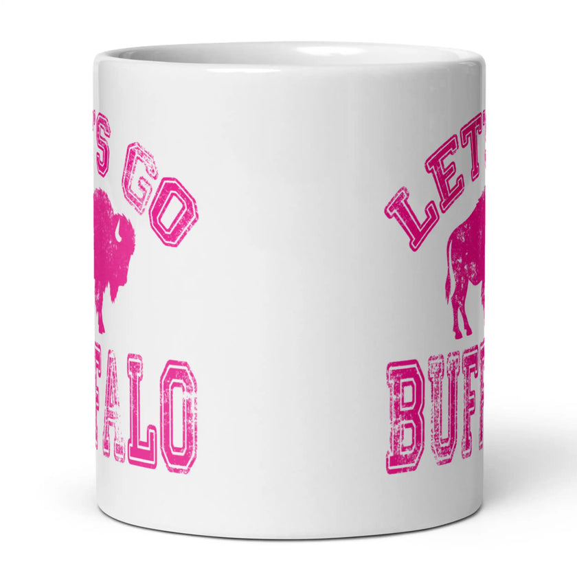 Side view of white ceramic mug with hot pink distressed ‘Lets Go Buffalo’ Buffalo football lettering and buffalo silhouette centered in design.
