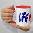 Close-up of white ceramic coffee mug with bold blue ‘LFG BFLO’ lettering and red buffalo silhouette centered, Buffalo football fan drinkware detail.
