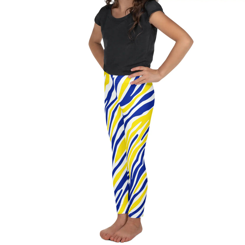 Left side view of kids’ Buffalo hockey leggings displaying the original blue and gold stripe design with bold Buffalo silhouettes.