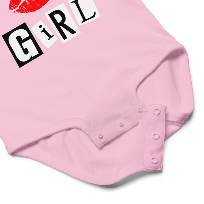 Close-up of pink mean girl energy baby bodysuit snap closure detail for easy diaper changes and soft cotton construction baby clothing design.