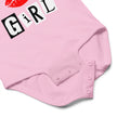 Close-up of pink mean girl energy baby bodysuit snap closure detail for easy diaper changes and soft cotton construction baby clothing design.