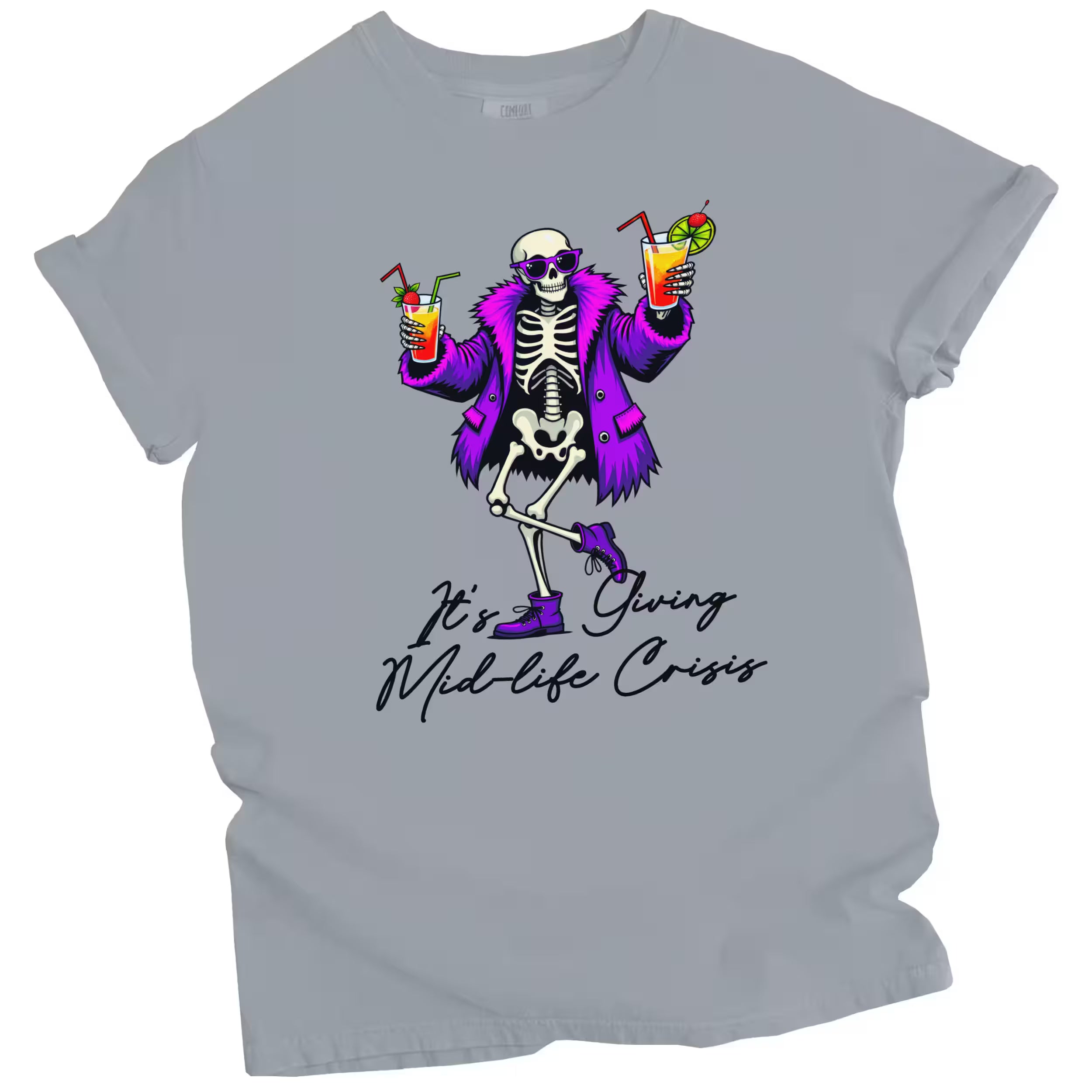 Gray “It’s Giving Mid-Life Crisis” t-shirt flat lay featuring playful skeleton with tropical drinks and sarcastic aging birthday message