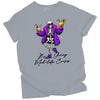 Gray “It’s Giving Mid-Life Crisis” t-shirt flat lay featuring playful skeleton with tropical drinks and sarcastic aging birthday message