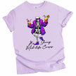 Purple “It’s Giving Mid-Life Crisis” t-shirt flat lay showing dancing skeleton in fur coat with drinks, bold funny birthday celebration graphic