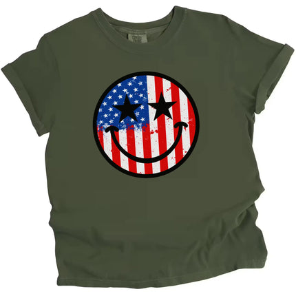 Patriotic smiling face t-shirt in green, paint splatter flag design with star eyes, fun and relaxed July 4th graphic tee