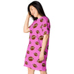 Woman posing in pink football print oversized nightwear featuring alternating large and small brown football pattern in soft relaxed fit.