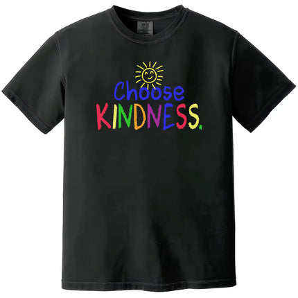 Black “Choose Kindness” t-shirt flat lay featuring rainbow crayon lettering and smiling sun design for a cheerful, positive message