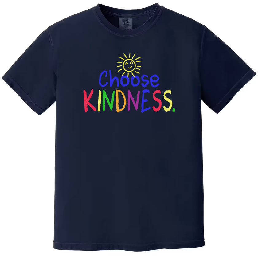 Navy “Choose Kindness” t-shirt flat lay showcasing colorful crayon-style text and happy sun graphic for everyday positive wear
