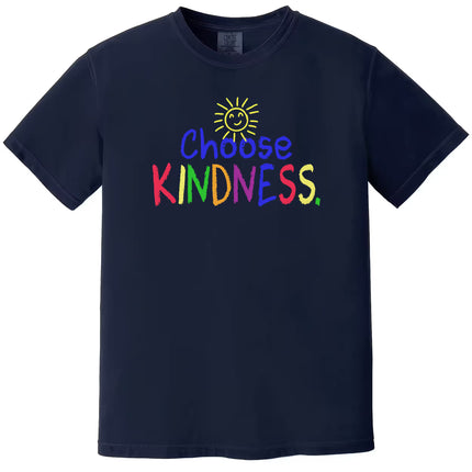 Navy “Choose Kindness” t-shirt flat lay showcasing colorful crayon-style text and happy sun graphic for everyday positive wear