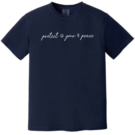 Navy “Protect Your Peace” t-shirt flat lay featuring fancy script font and small peace signs, perfect for everyday casual wear