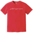 Red “Protect Your Peace” t-shirt flat lay featuring elegant script lettering and subtle peace sign icons for a minimalist, calming look
