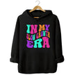Black “In My Slow Growth Era” hoodie featuring colorful retro neon text, positive mindset design for relaxed, confidence-forward style