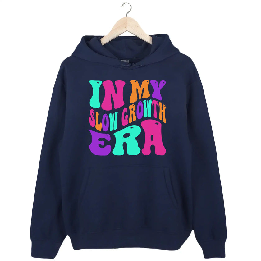 Navy “In My Slow Growth Era” hoodie with bold neon retro lettering, uplifting message for women focused on growth at their own pace