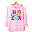 Pink “In My Slow Growth Era” hoodie with bright neon retro lettering, uplifting vibe for women embracing personal growth and cozy everyday wear