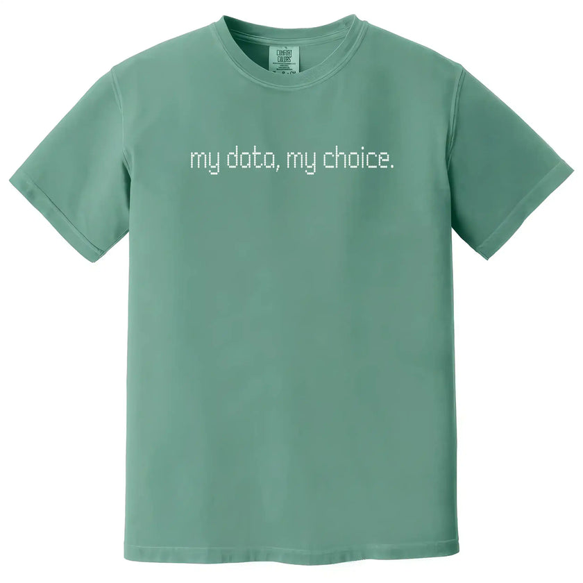 Green “My Data, My Choice” t-shirt flat lay with simple, modern lettering and minimalist statement for cause-minded wear