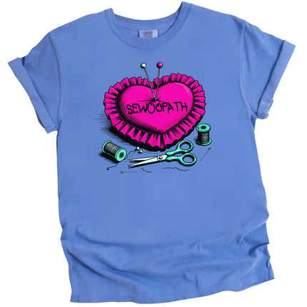 Funny sewing pun t-shirt in blue, heart-shaped pincushion with pins and thread, ‘Sewciopath’ design for crafters and sewists.