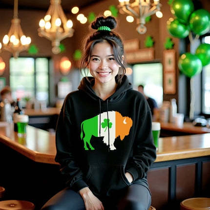 Female model wearing black Buffalo Irish flag buffalo hoodie sitting inside an Irish pub, celebrating St. Patrick’s Day in style