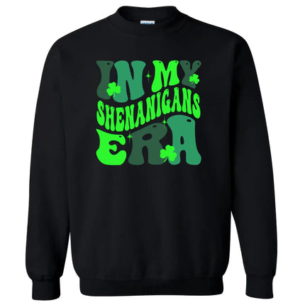 Black “In My Shenanigans Era” St. Patrick’s Day sweatshirt flat lay featuring fun whimsical font and shamrock accents for festive cozy style
