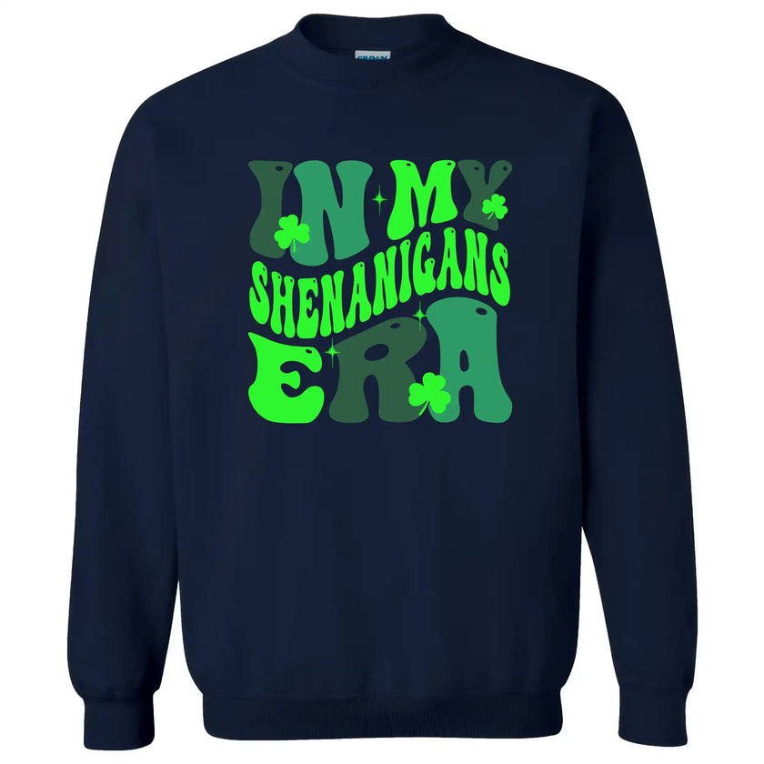 Navy “In My Shenanigans Era” St. Patrick’s Day sweatshirt flat lay featuring playful font and shamrocks for stylish holiday fun