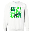 White “In My Shenanigans Era” St. Patrick’s Day sweatshirt flat lay with playful font and shamrock details for cute and festive holiday wear