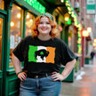 Female model wearing black Buffalo Irish flag St. Patrick’s Day t-shirt standing outside in front of an Irish pub