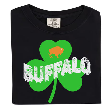 Black Buffalo Irish St. Patrick’s Day t-shirt flat lay with bold shamrock design, distressed Buffalo lettering, and orange buffalo detail