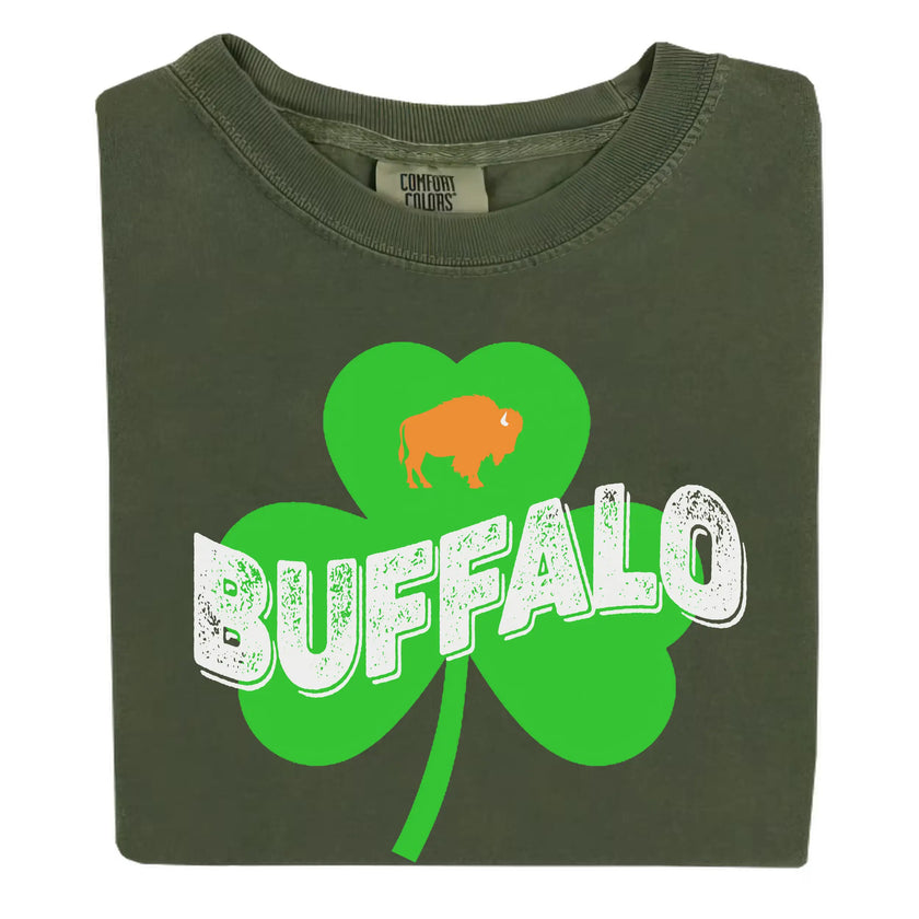 Dark green Buffalo Irish St. Patrick’s Day t-shirt flat lay featuring retro shamrock, distressed lettering, and orange buffalo graphic