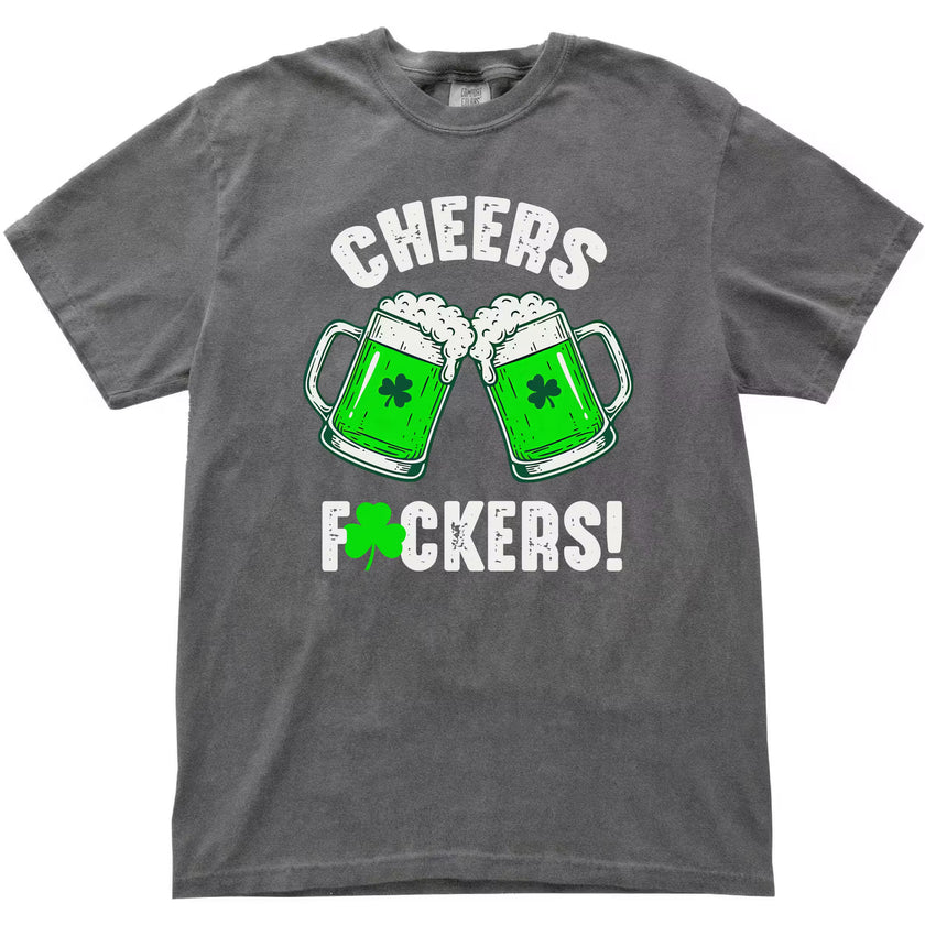 Gray “Cheers Fuckers!” St. Patrick’s Day t-shirt flat lay with two green beer mugs clinking and shamrock detail in the U
