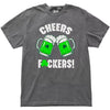 Gray “Cheers Fuckers!” St. Patrick’s Day t-shirt flat lay with two green beer mugs clinking and shamrock detail in the U