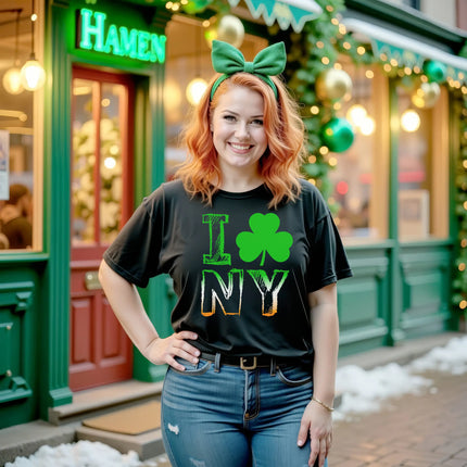 Female model wearing black I Shamrock NY St. Patrick’s Day t-shirt standing outside in front of an Irish pub celebrating the holiday