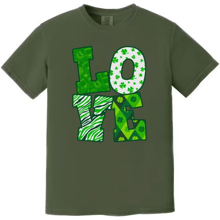 Dark green St. Patrick’s Day LOVE t-shirt flat lay featuring bold patterned letters in festive Irish colors