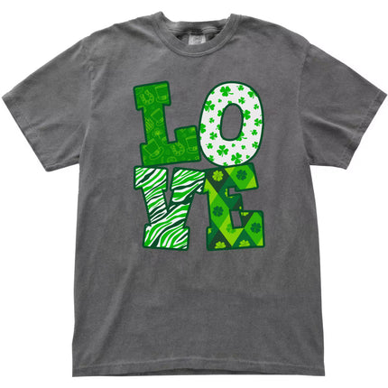 Gray St. Patrick’s Day LOVE t-shirt flat lay with colorful shamrock-inspired patterns inside large LOVE lettering