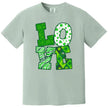 Light green St. Patrick’s Day LOVE t-shirt flat lay with playful Irish-themed patterns filling large block letters