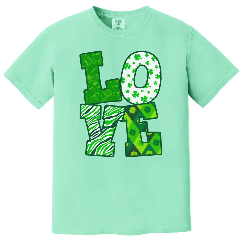 Neon green St. Patrick’s Day LOVE t-shirt flat lay featuring bright, high-contrast festive lettering