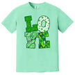Neon green St. Patrick’s Day LOVE t-shirt flat lay featuring bright, high-contrast festive lettering