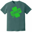 Green St. Patrick’s Day Lucky t-shirt flat lay featuring a large clover and bold cut-out “Lucky” design