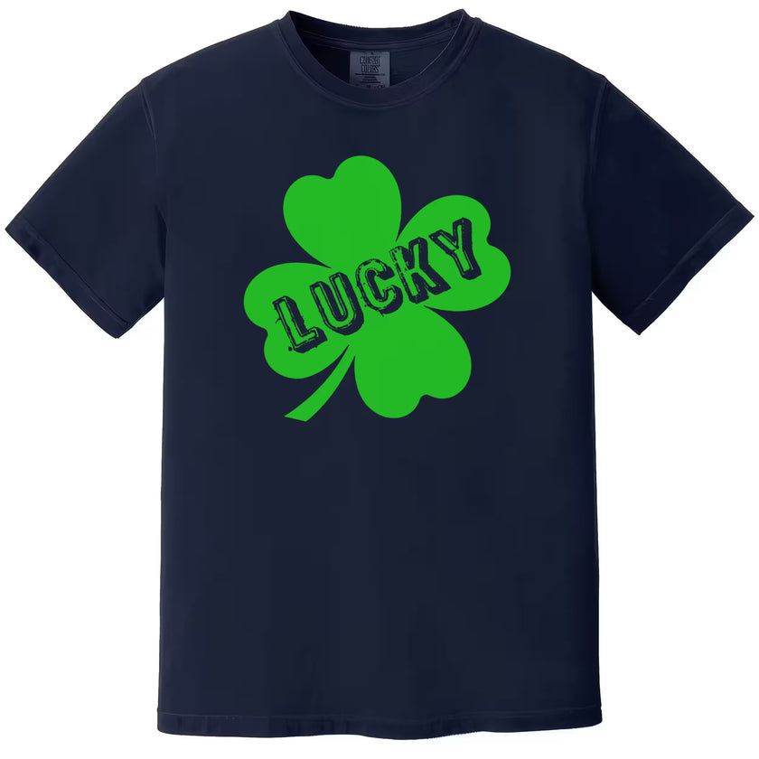 Navy Lucky t-shirt flat lay with festive four-leaf clover graphic and distressed lettering, perfect for St. Patrick’s Day fun