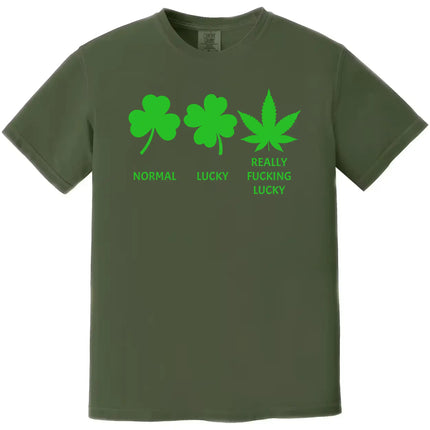 Green “Normal Lucky Really Fucking Lucky” t-shirt flat lay showcasing St. Patrick’s Day icons and humorous weed leaf pun