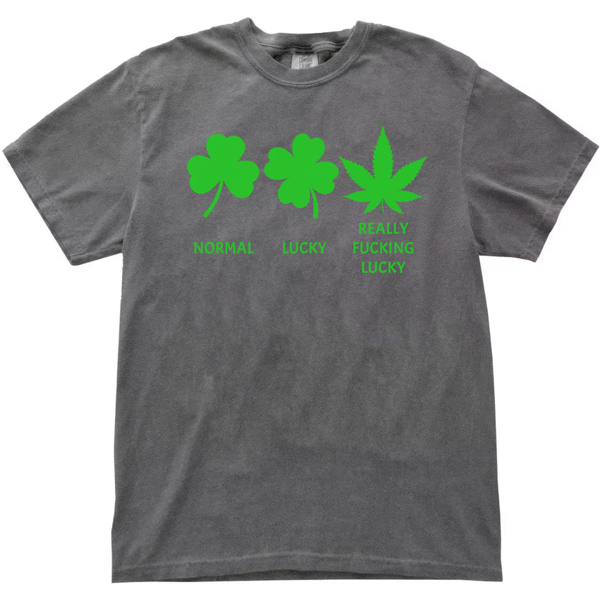 Gray St. Patrick’s Day funny luck t-shirt flat lay with shamrock, four-leaf clover, and weed leaf graphic