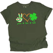 Green St. Patrick’s Day Peace, Love, Luck t-shirt flat lay featuring a peace sign hand, orange hearts, and a green four-leaf clover