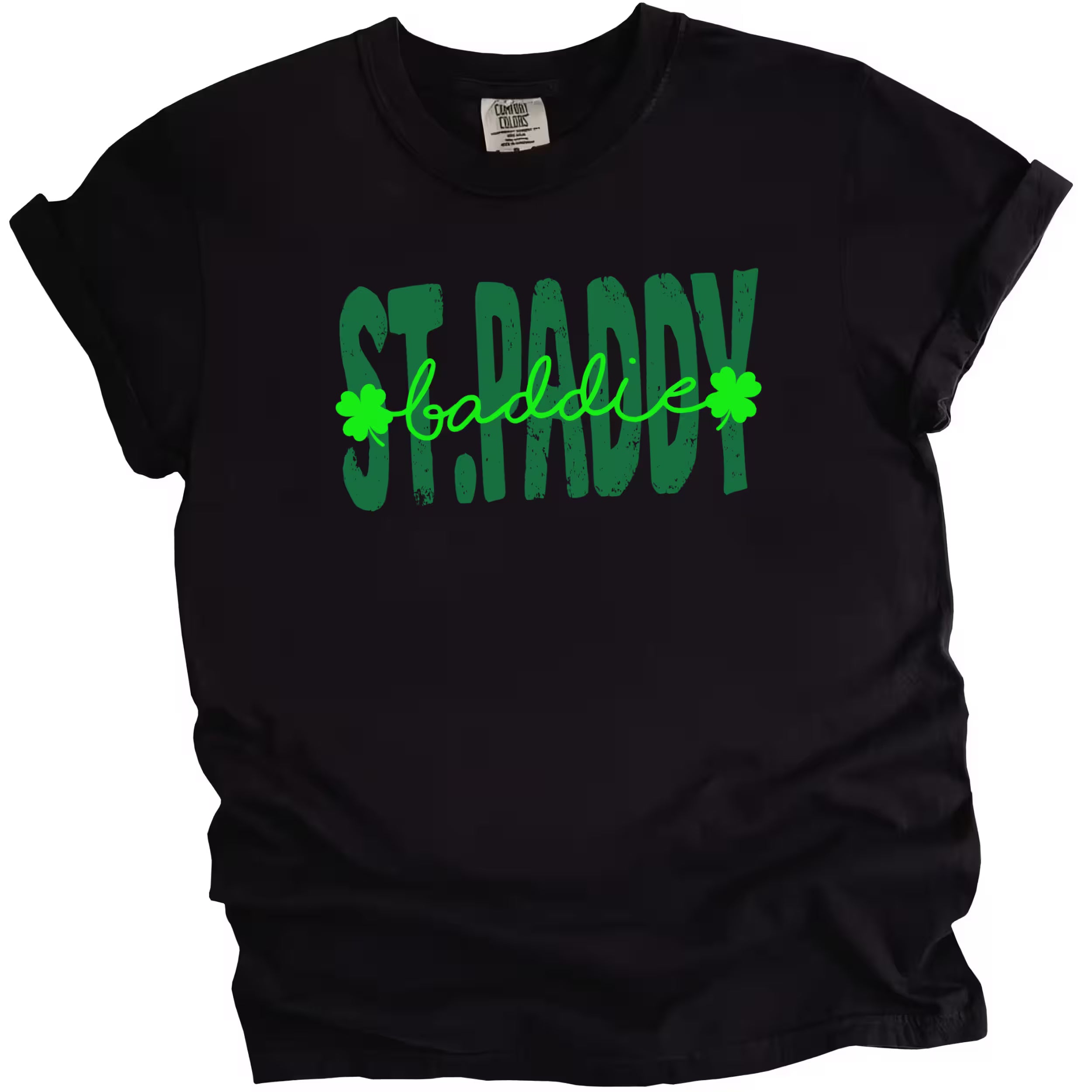 Black St. Paddy Baddie t-shirt flat lay featuring bold green text and high-contrast festive lettering